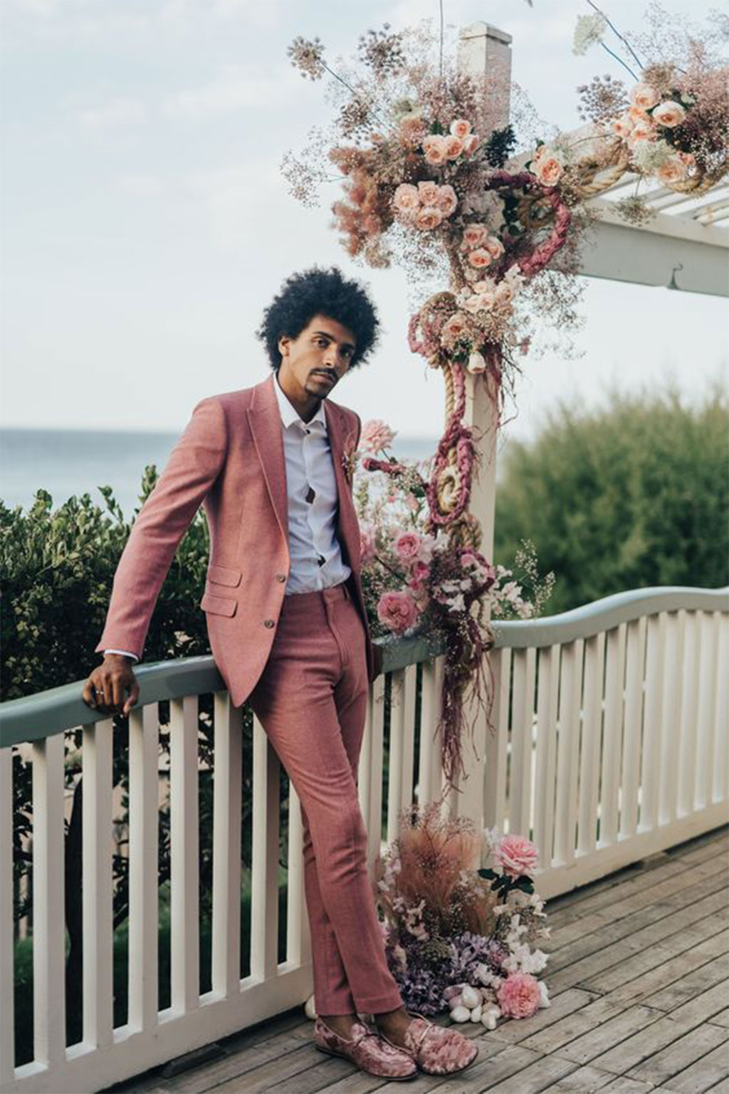 grooms in pink suits