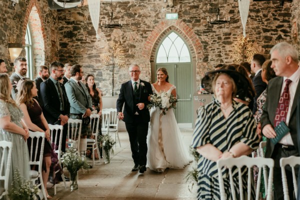 Father walks daughter bride down the aisle