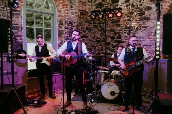 Wedding band musician guitarist plays music songs