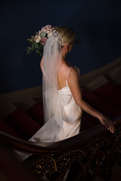 Bride walks down the staircase