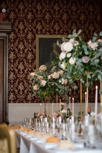 Roses flowers bouquet sitting on tables candles lit