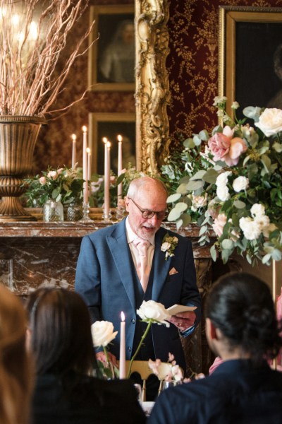 Father reading speech to couple and audience