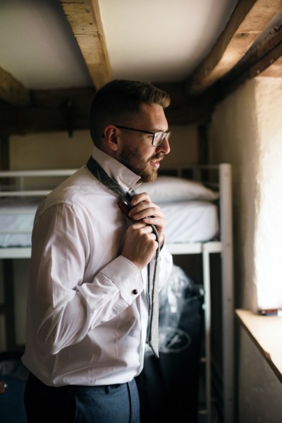 Groom getting ready shirt tie