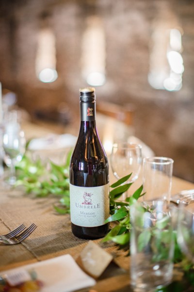 Bottle of white wine and glasses on table