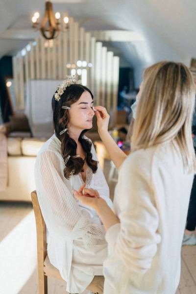 Bride getting her makeup done by MUA eyeshadow