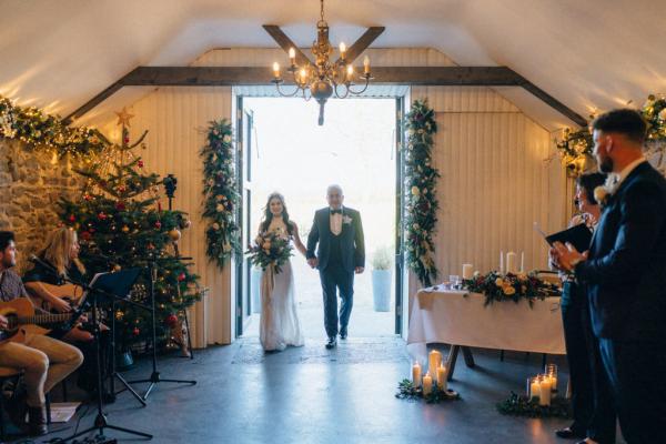 Father of the bride enter ceremony room walking down the aisle