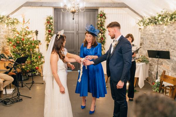 Bride groom at alter with officiant/celebrant