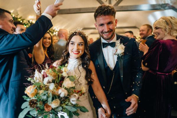 Bride and groom confetti guests exit ceremony