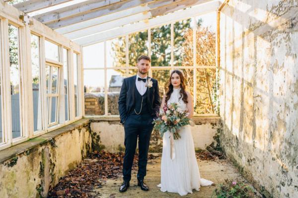 Bride groom within greenhouse window interior setting