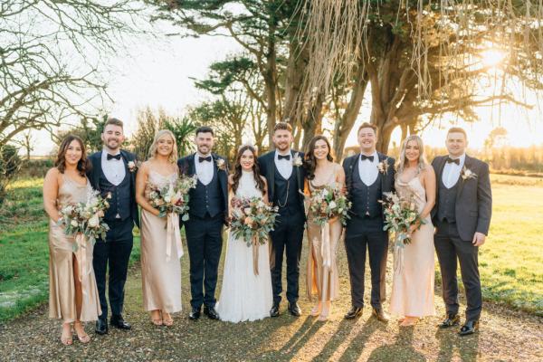 Forest setting with bride groom groomsmen best man and bridesmaids