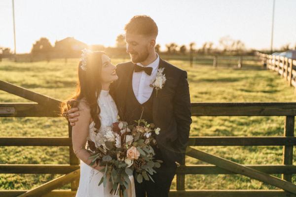 Sunset couple bride groom farm fence