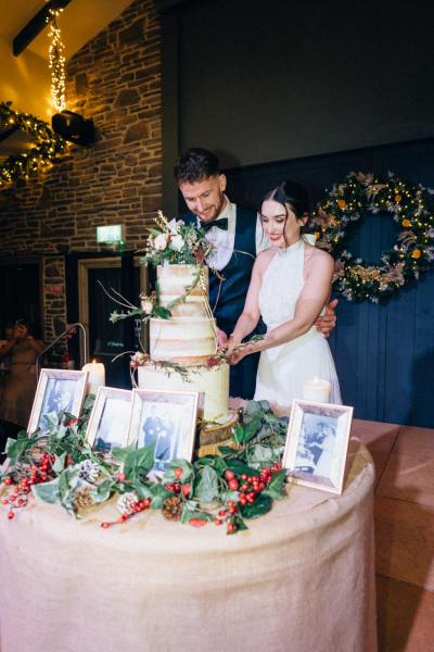 Bride and groom cutting the wedding cake photo frames