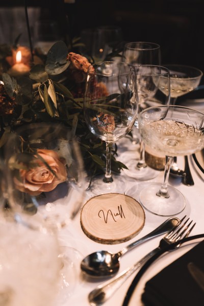 Close up table setting cutlery number placemat flowers roses