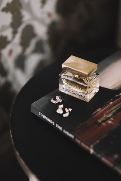 Gold perfume bottle and earrings diamonds