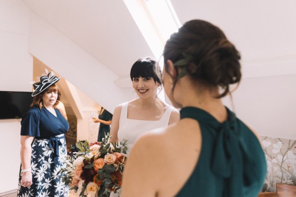 Bride holding bouquet and bridesmaids