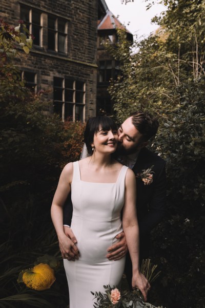 Kiss on the cheek from groom to bride