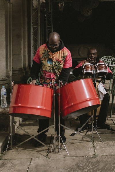 Colourful attire man playing drums musician