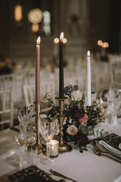 Table and chairs for guests roses flowers candles wine glasses