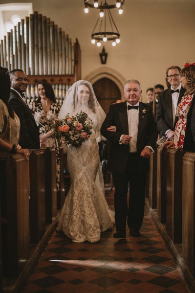 Father of the bride walks down the aisle in church