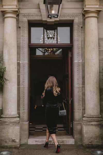 Woman enters church wedding venue entrance