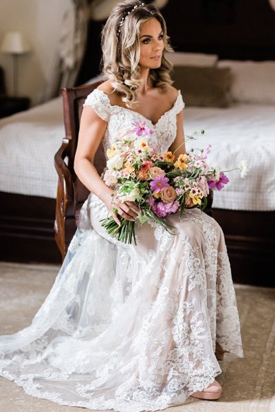 Bouquet flowers lace dress gown blonde wavy hair