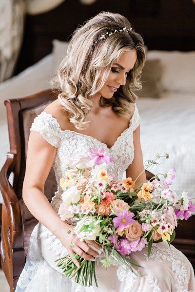 Bouquet flowers lace dress gown blonde wavy hair