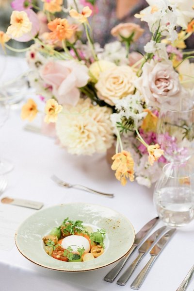 Colourful roses flowers on table dinner food menu for guests