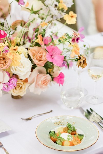 Colourful roses flowers on table dinner food menu for guests