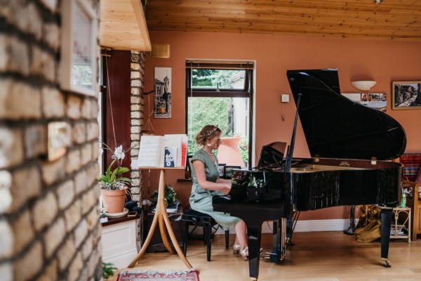 Bridesmaid playing the piano forte