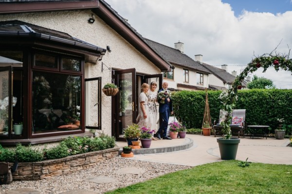 Garden house entrance family and bride