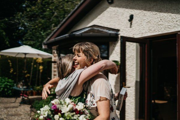 Bride hugging friend/woman