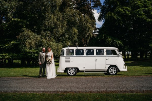 White wedding car couple bride and groom