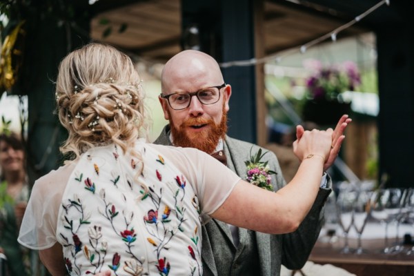 Bride and groom dance together