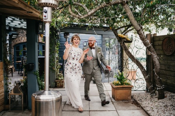 Bride and groom enter ballroom dining room