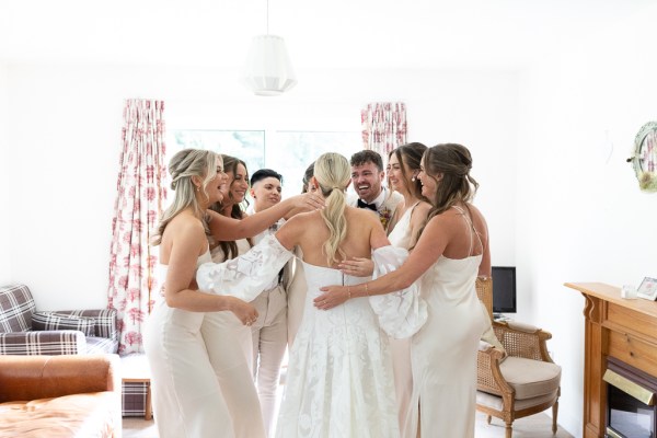 Bride groom and bridesmaids celebrate smile laugh