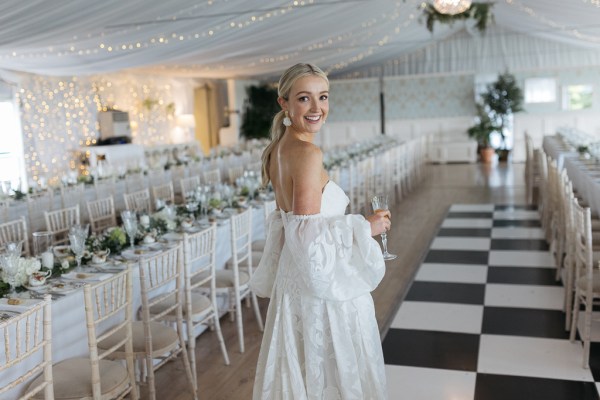 Picture of his bride in empty dining room setting