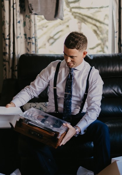 Groom opening gift