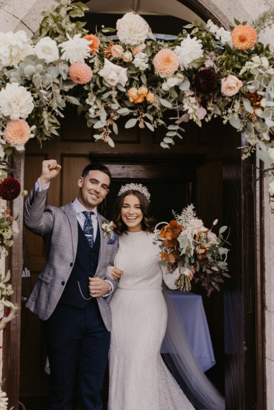 Groom cheers as he exits church with bride