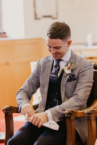 Groom awaits the bride at alter