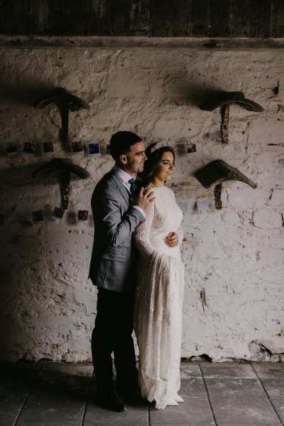 Bride and groom in barn interior home