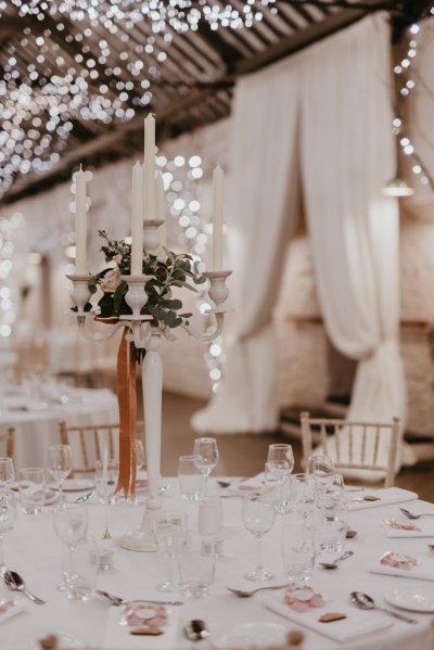 Empty dining room close of table and chair candles flowers cutlery