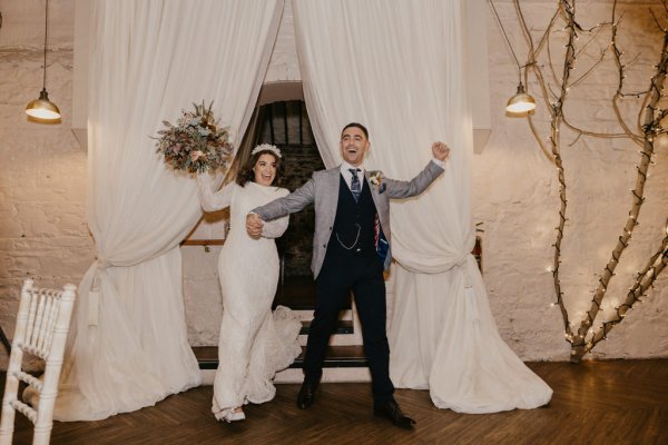 Bride and groom enter ballroom dining room