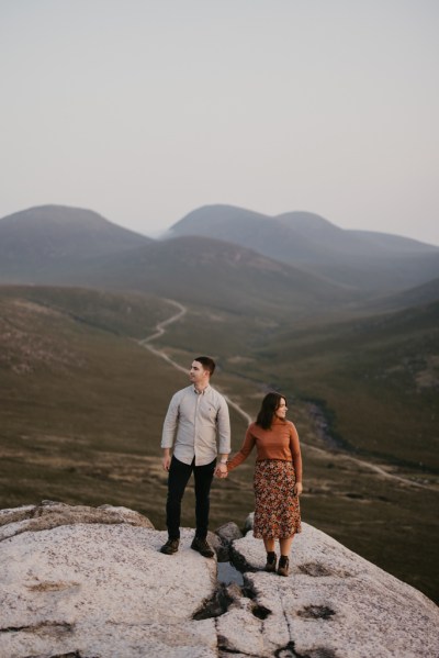 Change of clothes bride groom on top of mountain cliff