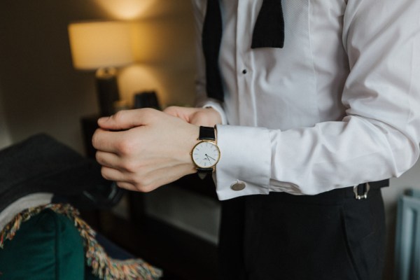 Close up of grooms watch detail jewelry suit detail tuxedo