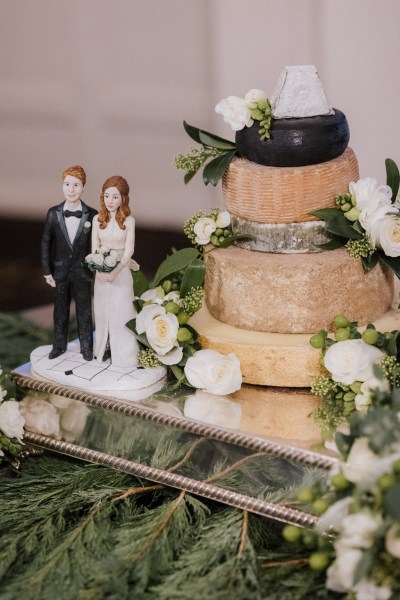 Cheeseboard cheese white roses flowers platter bride and groom statues