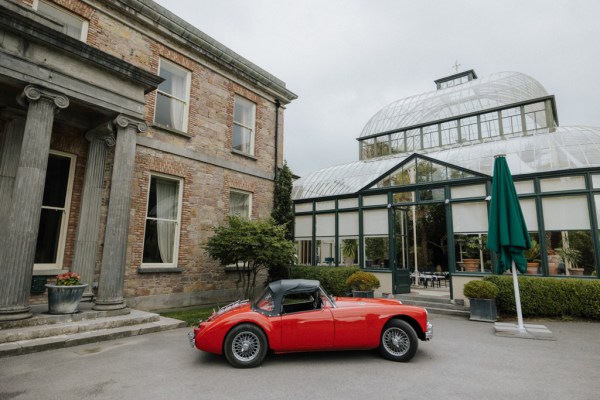 Wedding venue exterior and red wedding car