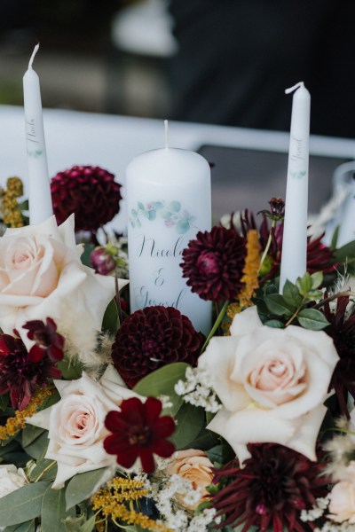 Candles and red pink flowers roses