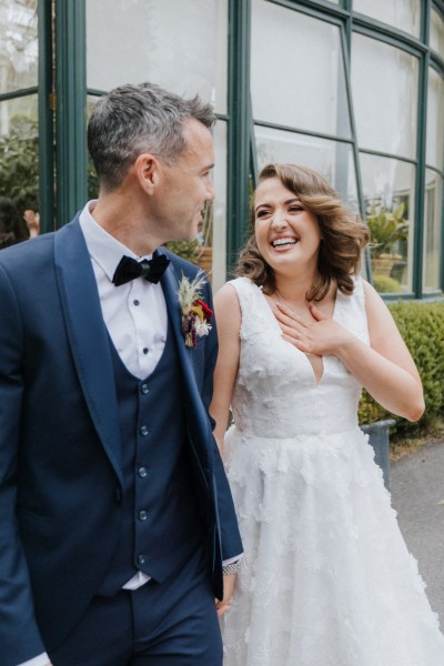 Bride and groom smiling laughing together