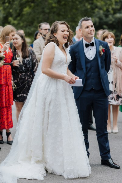 Confetti being thrown over couple bride and groom exit ceremony church setting