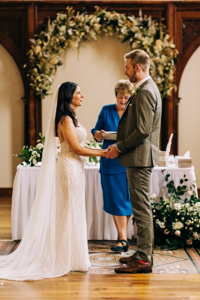 Celebrant bride and groom at alter to church